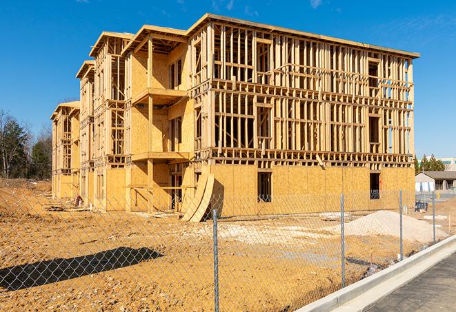 a job site enclosed by temporary chain link fences, ensuring safety for workers and pedestrians in Plantersville